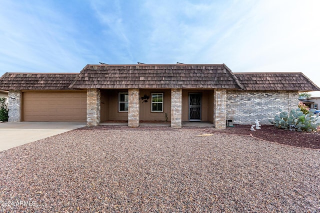 ranch-style house featuring a garage