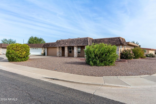 ranch-style home featuring a garage