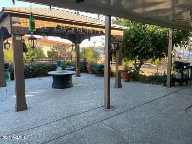 view of patio featuring a gazebo and ceiling fan