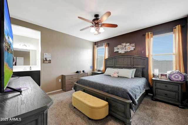 30777 W Whitton Ave, Buckeye, AZ 85396 - bedroom featuring light colored carpet, multiple windows, baseboards, and connected bathroom