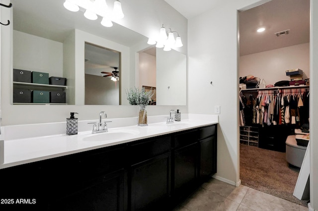 30777 W Whitton Ave, Buckeye, AZ 85396 - bathroom with double vanity, a ceiling fan, tile patterned floors, and a walk in closet