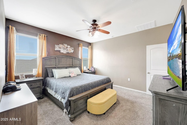 30777 W Whitton Ave, Buckeye, AZ 85396 - bedroom featuring light carpet, baseboards, and a ceiling fan