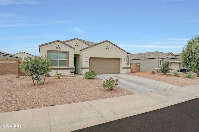 30777 W Whitton Ave, Buckeye, AZ 85396 - mediterranean / spanish house with concrete driveway, a garage, and stucco siding