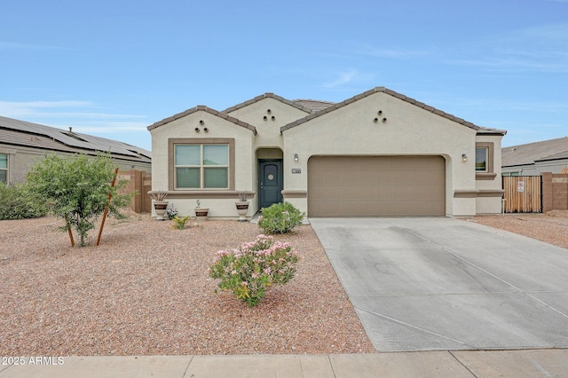 30777 W Whitton Ave, Buckeye, AZ 85396 - mediterranean / spanish house with a garage, driveway, stucco siding, and a tile roof