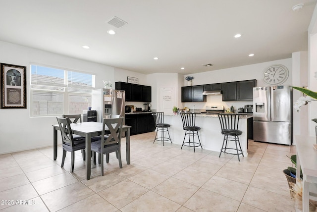 30777 W Whitton Ave, Buckeye, AZ 85396 - dining space featuring light tile patterned flooring and recessed lighting