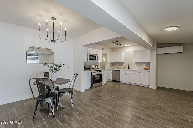 1616 E Pecan Rd, Phoenix, AZ 85040 - dining area with dark wood-style floors and a chandelier