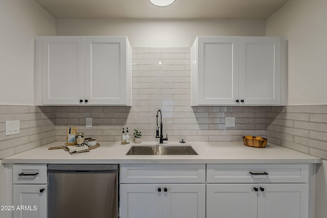 1616 E Pecan Rd, Phoenix, AZ 85040 - kitchen with dishwasher, white cabinetry, and decorative backsplash