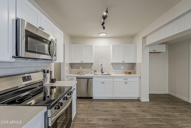 1616 E Pecan Rd, Phoenix, AZ 85040 - kitchen featuring stainless steel appliances, tasteful backsplash, white cabinets, and light countertops