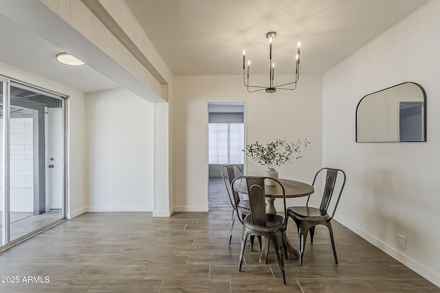 1616 E Pecan Rd, Phoenix, AZ 85040 - dining room with wood finished floors and a chandelier