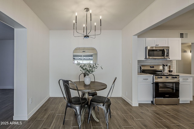 1616 E Pecan Rd, Phoenix, AZ 85040 - dining space with wood finish floors and a chandelier