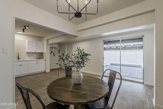 1616 E Pecan Rd, Phoenix, AZ 85040 - dining room with wood finished floors and a chandelier