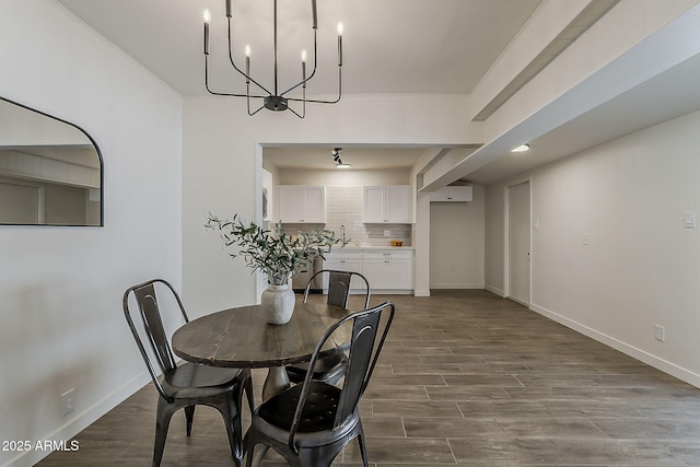 1616 E Pecan Rd, Phoenix, AZ 85040 - dining room with a wall mounted AC, a chandelier, and dark wood-style floors