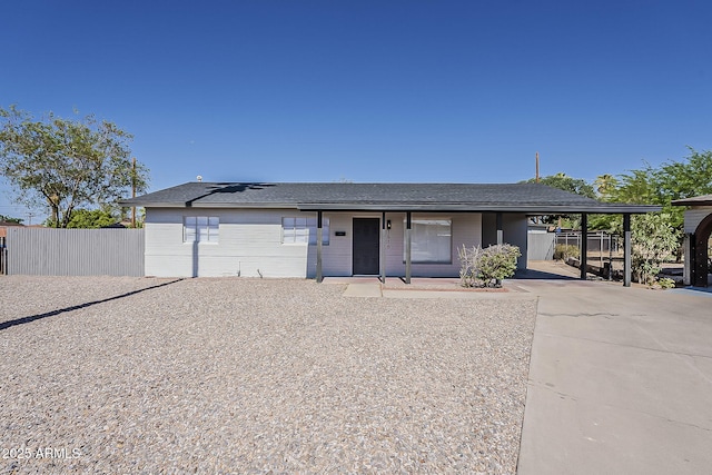 1616 E Pecan Rd, Phoenix, AZ 85040 - view of front facade with solar panels, a carport, driveway, and a porch