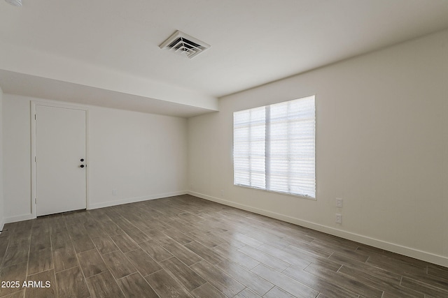 1616 E Pecan Rd, Phoenix, AZ 85040 - spare room featuring wood tiled floors and baseboards