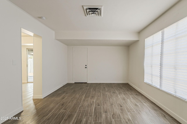 1616 E Pecan Rd, Phoenix, AZ 85040 - spare room with dark wood finished floors and a smoke detector