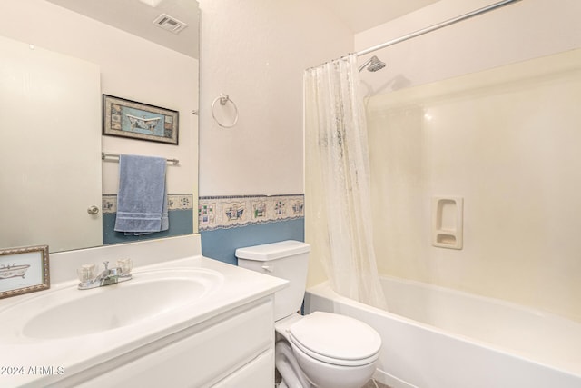 full bathroom featuring shower / bath combination with curtain, vanity, and toilet