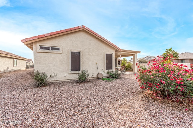 back of property featuring a patio