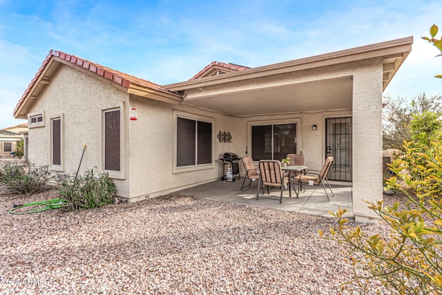 rear view of property with a patio