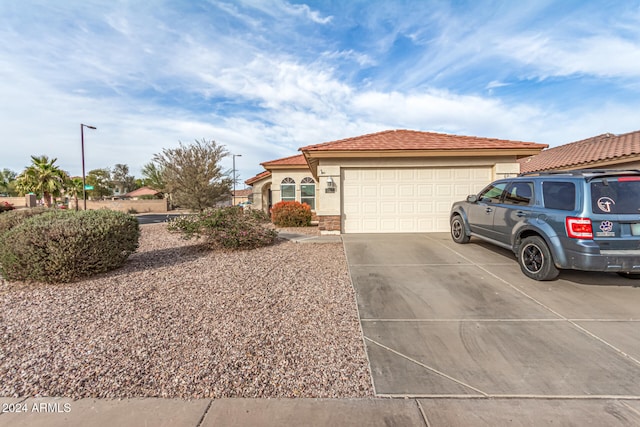 view of front of property with a garage