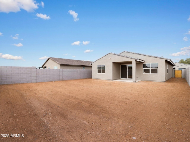 rear view of house with a patio area