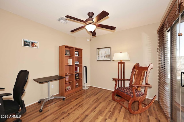 interior space featuring ceiling fan and wood-type flooring