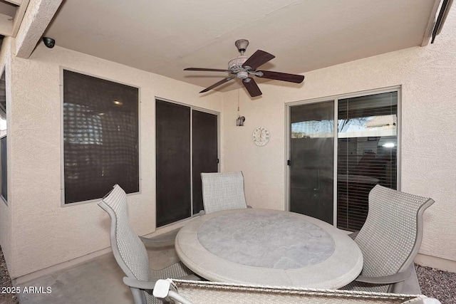 view of patio featuring ceiling fan