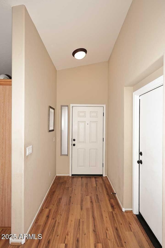 doorway with wood-type flooring