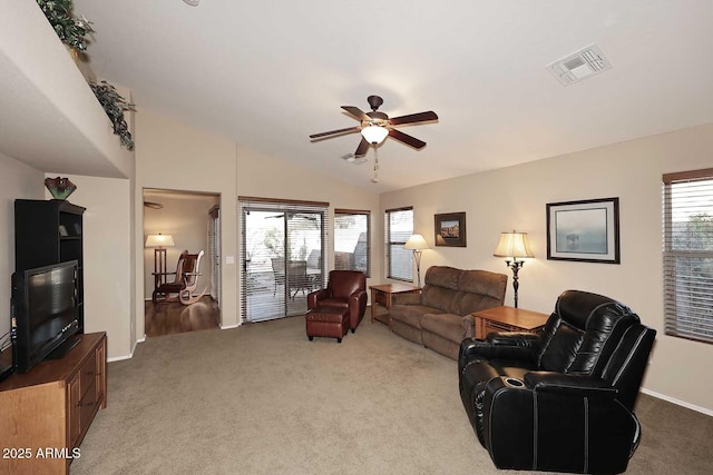 carpeted living room with lofted ceiling and ceiling fan