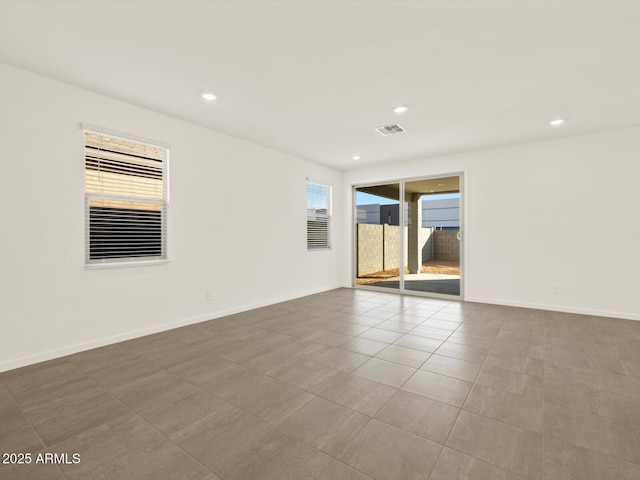 5573 S 246th Ave, Buckeye, AZ 85326 - tiled empty room with recessed lighting and baseboards