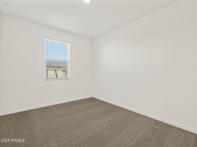 5573 S 246th Ave, Buckeye, AZ 85326 - unfurnished room with baseboards and dark colored carpet