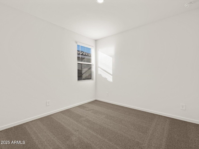 5573 S 246th Ave, Buckeye, AZ 85326 - spare room with baseboards and dark carpet