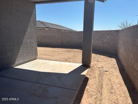 5573 S 246th Ave, Buckeye, AZ 85326 - fenced backyard featuring a patio