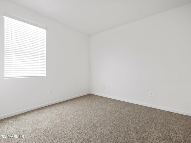 5573 S 246th Ave, Buckeye, AZ 85326 - spare room featuring carpet floors and baseboards