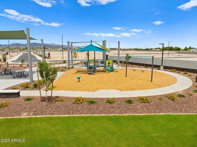 5573 S 246th Ave, Buckeye, AZ 85326 - view of property's community featuring a lawn and a mountain view
