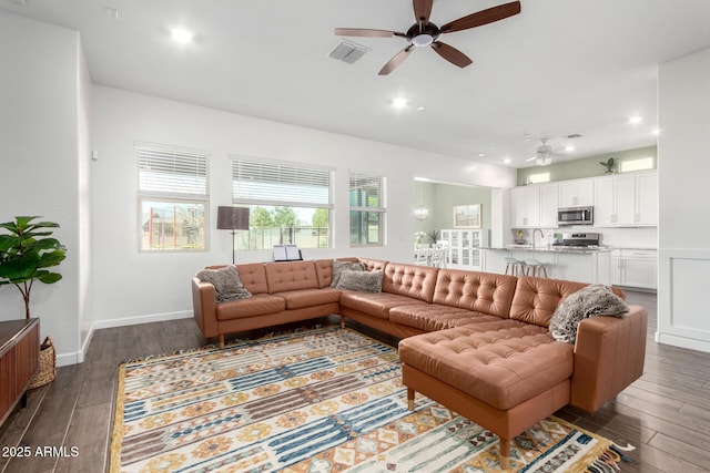 21716 E Waverly Dr, Queen Creek, AZ 85142 - living room with dark hardwood / wood-style floors, sink, and ceiling fan