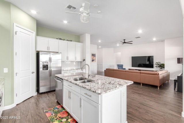 21716 E Waverly Dr, Queen Creek, AZ 85142 - kitchen featuring white cabinetry, sink, a kitchen island with sink, and stainless steel appliances