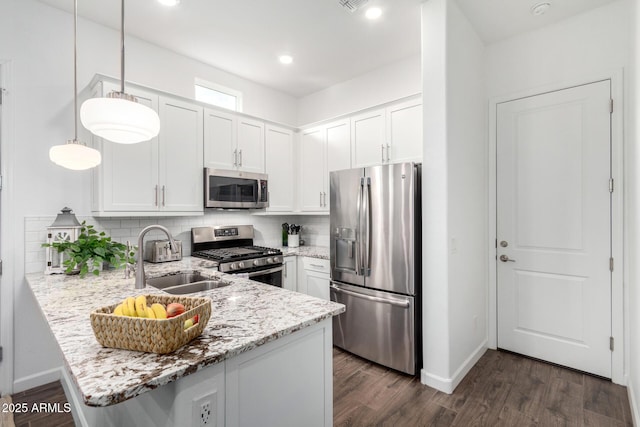 21716 E Waverly Dr, Queen Creek, AZ 85142 - kitchen featuring pendant lighting, white cabinetry, stainless steel appliances, and kitchen peninsula