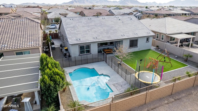 21716 E Waverly Dr, Queen Creek, AZ 85142 - view of pool with a mountain view, a trampoline, and a playground