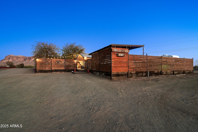 view of outbuilding featuring a mountain view