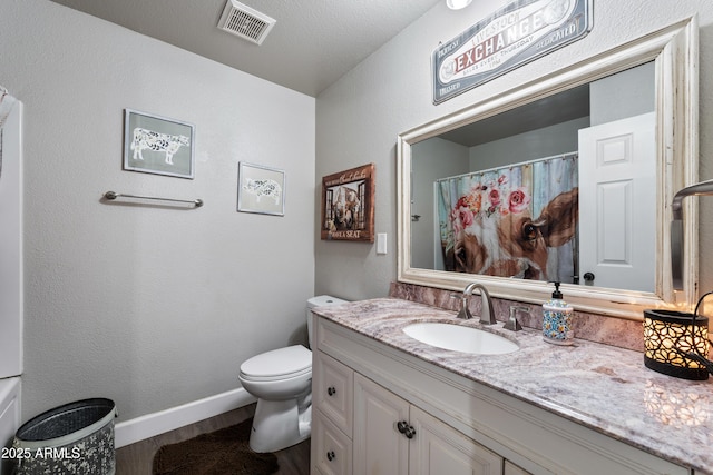 bathroom featuring hardwood / wood-style floors, toilet, a shower with shower curtain, and vanity