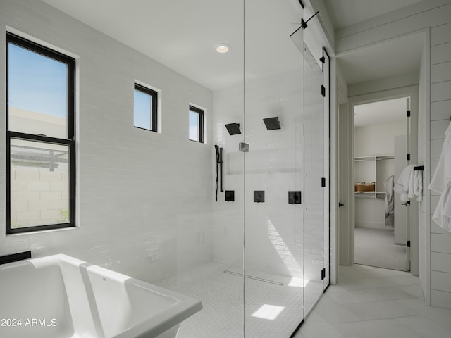 bathroom featuring walk in shower and tile floors