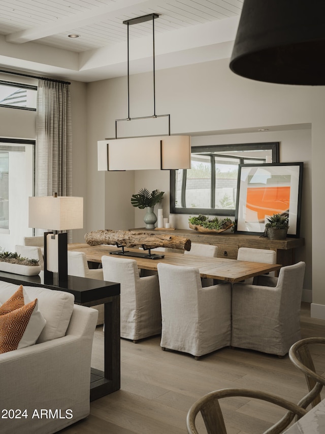 kitchen with light wood-type flooring, pendant lighting, and wooden ceiling