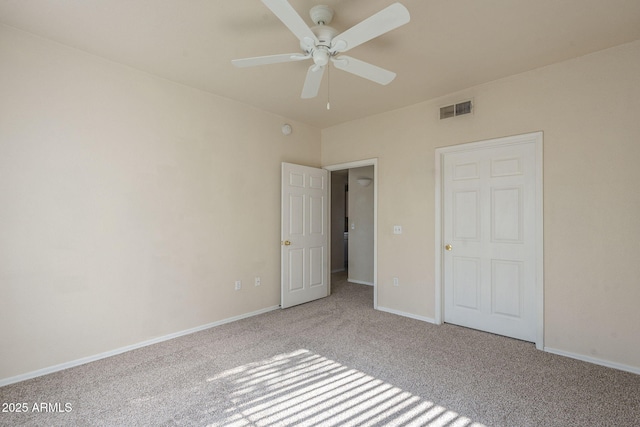 unfurnished bedroom featuring light carpet and ceiling fan