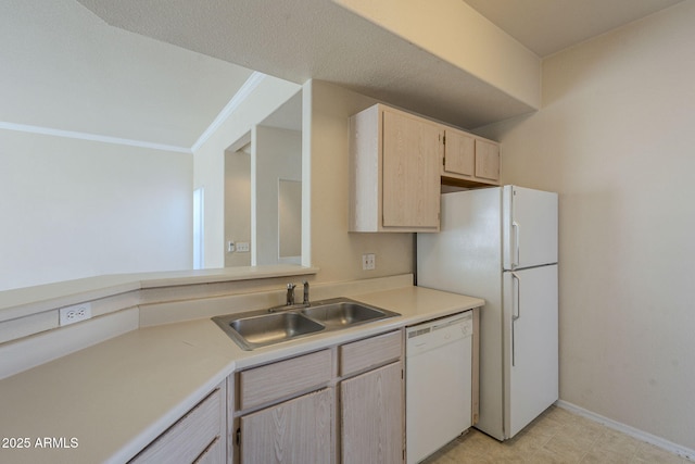 kitchen featuring crown molding, sink, light brown cabinetry, and white appliances