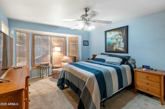 bedroom with light carpet and ceiling fan