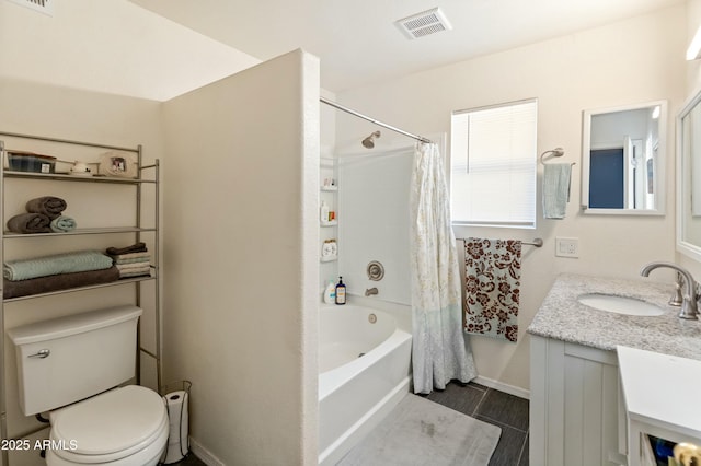 full bathroom with shower / tub combo, vanity, and toilet