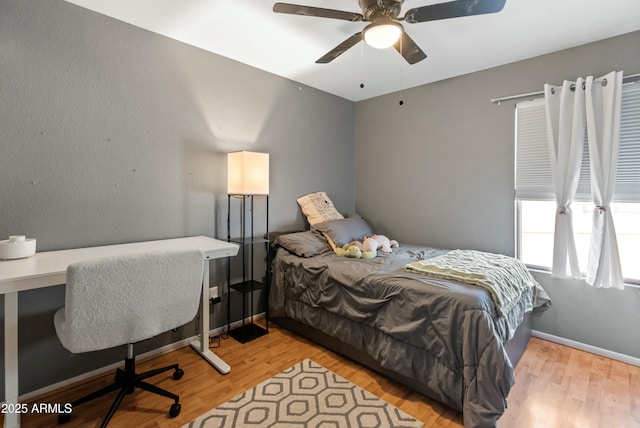 bedroom featuring ceiling fan and light hardwood / wood-style floors