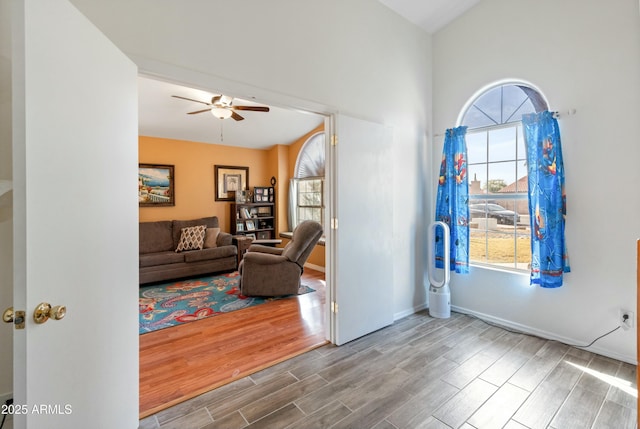 foyer entrance featuring ceiling fan