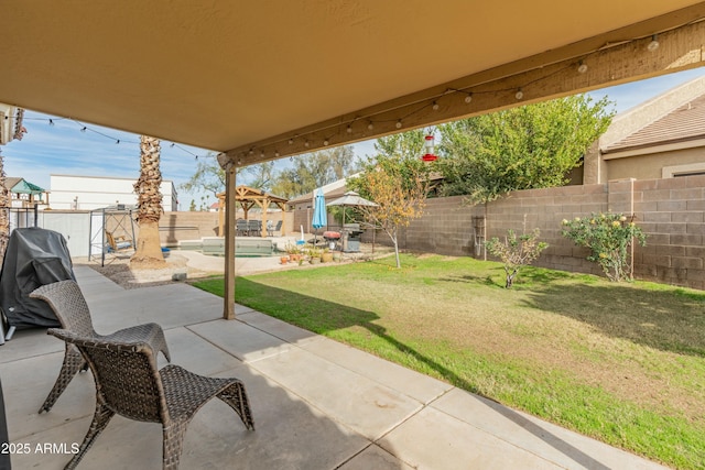 view of patio featuring grilling area and a pool