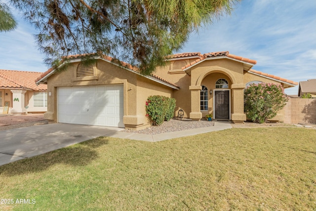 mediterranean / spanish-style house featuring a front lawn and a garage